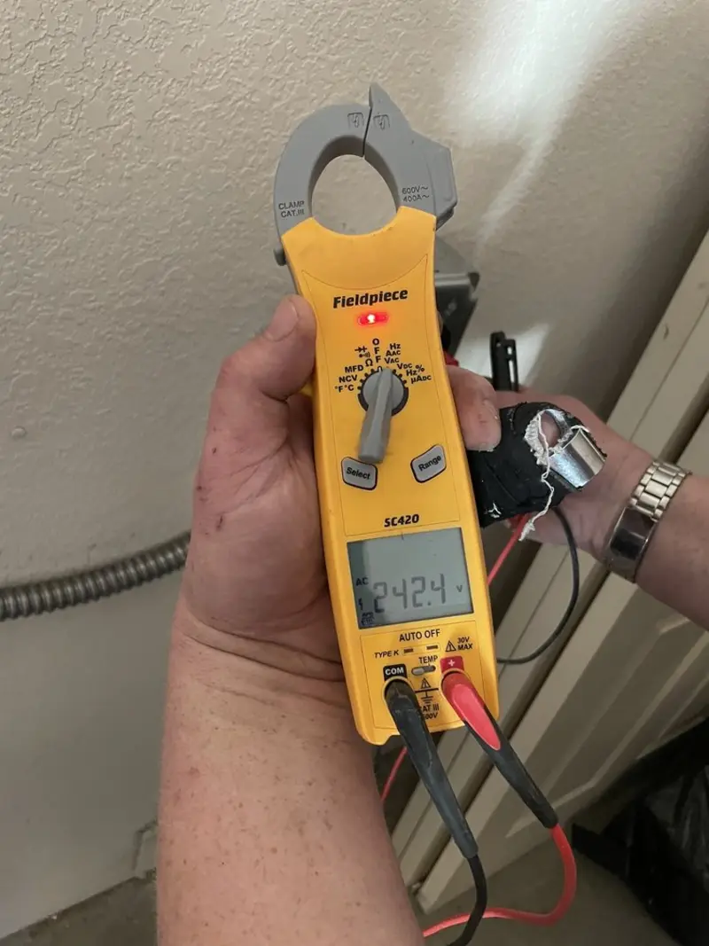 Voltage testing with clamp meter during Electrical Installation Services in Severn